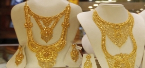 Amid Global Cues and Low Demand Gold Slips by Rs 100